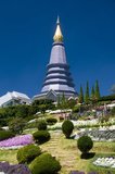 Doi Inthanon is Thailand's highest mountain at 2,595 metres. It is named after Phra Inthawichayanon, the last King of Chiang Mai, who died at the turn of the century, and whose remains lie interred in a small white chedi near the summit.<br/><br/>Near the summit stand two remarkable chedis. The first is the copper-coloured spire of Phra Mahathat Chedi Nabhamethanidon, built by the Royal Thai Air Force to commemorate the 60th birthday of King Bhumibol, and inaugurated on December 5, 1987. Close by, but clad in lilac-purple rather than copper, stands the less massive, but more elegant spire of Phra Mahathat Chedi Nabhabolbhumisiri, similarly built by the air force to commemorate the 60th birthday of Queen Sirikit, and inaugurated on August 12, 1992.