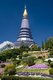 Doi Inthanon is Thailand's highest mountain at 2,595 metres. It is named after Phra Inthawichayanon, the last King of Chiang Mai, who died at the turn of the century, and whose remains lie interred in a small white chedi near the summit.<br/><br/>Near the summit stand two remarkable chedis. The first is the copper-coloured spire of Phra Mahathat Chedi Nabhamethanidon, built by the Royal Thai Air Force to commemorate the 60th birthday of King Bhumibol, and inaugurated on December 5, 1987. Close by, but clad in lilac-purple rather than copper, stands the less massive, but more elegant spire of Phra Mahathat Chedi Nabhabolbhumisiri, similarly built by the air force to commemorate the 60th birthday of Queen Sirikit, and inaugurated on August 12, 1992.